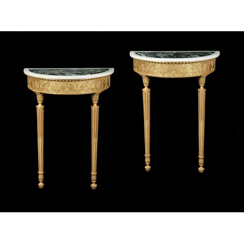 A PAIR OF GEORGE III DEMI-LUNE GILTWOOD CONSOLE TABLES